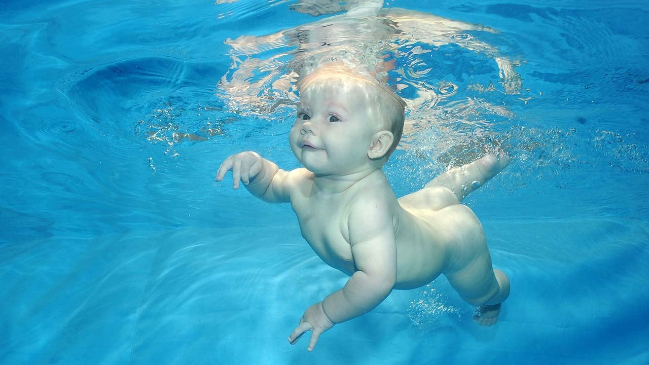 A baby swims underwater at 'London Baby Swim' in London on June 11, 2010. (Phil Shaw/Barcroft Media/Getty Images)