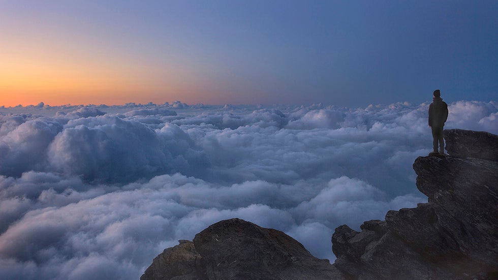 Photographer Roberto Bertero stands on the summit of Mount Rocciamelone in Susa Valley, Italy. (Roberto Bertero/Caters News Agency)