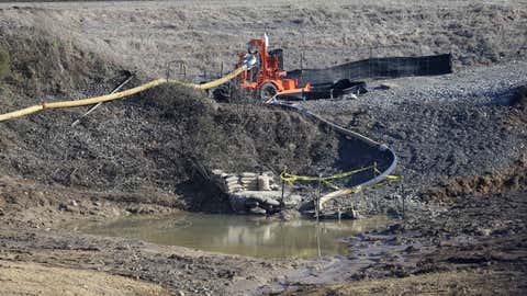 In this January 14, 2016, photo, a drainage pipe that was the original culprit of the coal ash spill is seen at the Dan River Steam Station in Eden, North Carolina. The state's top public health official acted unethically and possibly illegally by telling residents living near Duke Energy coal ash pits that their well water is safe to drink when it's contaminated with a chemical known to cause cancer, a state toxicologist said in sworn testimony.