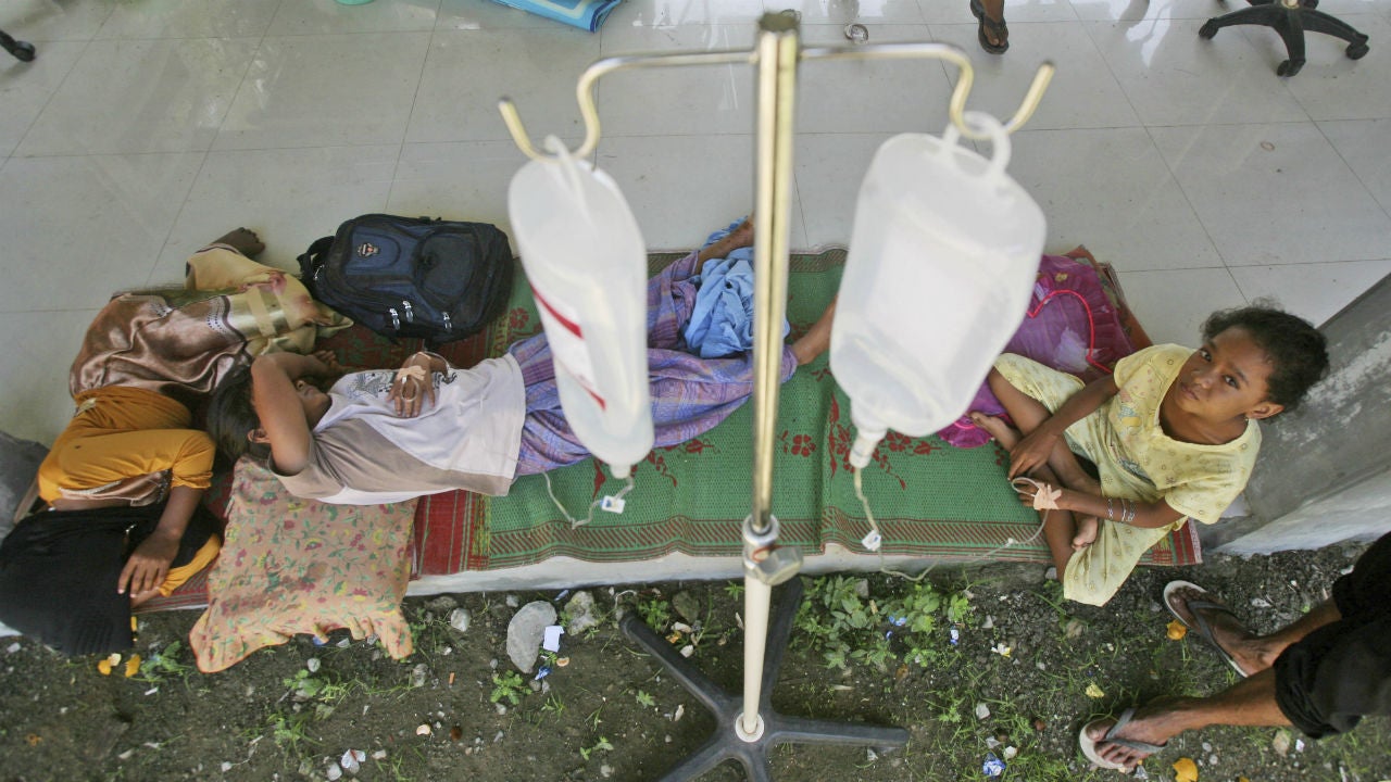 Earthquake survivors receive medical treatment outside of a hospital in Meureudu, Aceh province, Indonesia, Thursday, Dec. 8, 2016. Humanitarian organizations descended on Indonesia's Aceh province Thursday as the local disaster agency called for urgent food supplies and officials raced to assess the full extent of damage from an earthquake that killed more than 100 people. (AP Photo/Binsar Bakkara)