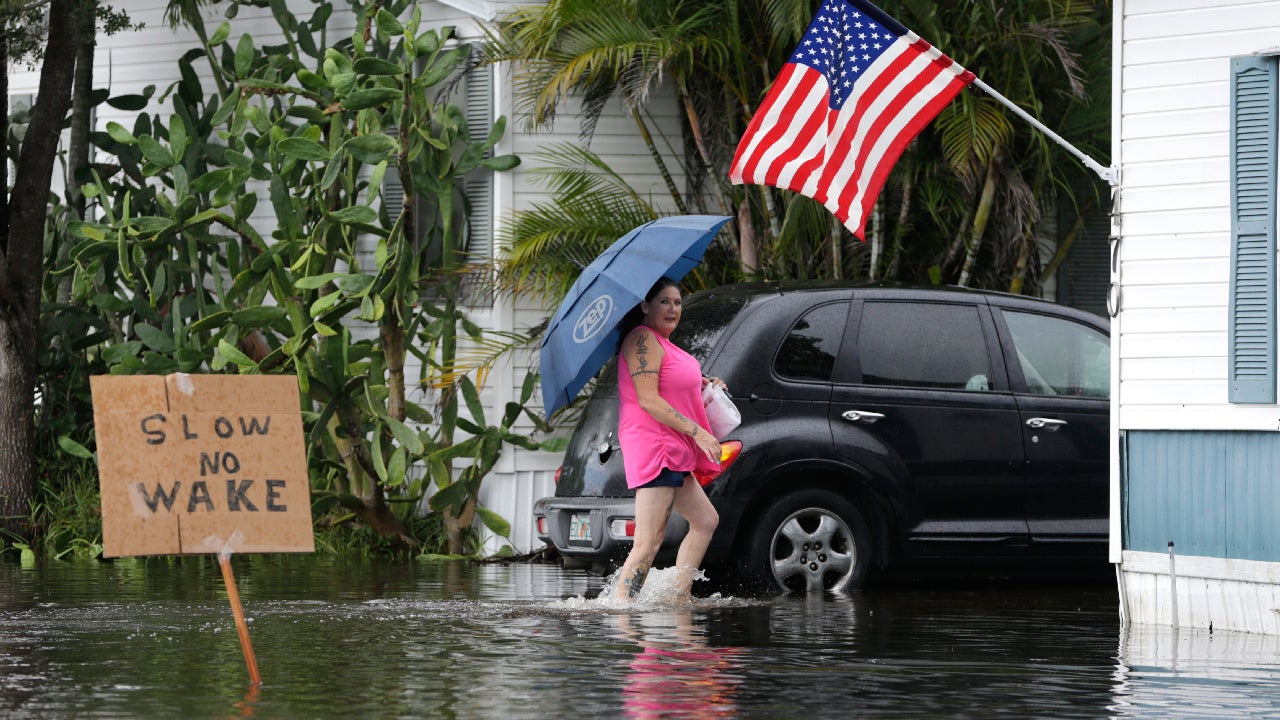 Peggy Wallace walks to her home in the Sunshine Village mobile home park, Wednesday, June 7, 2017, in Davie, Florida. (AP Photo/Lynne Sladky)