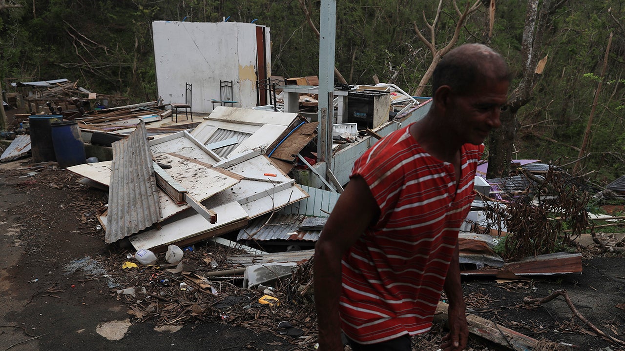 Antonio Bonilla, a 60 year old resident of the neighborhood of La Hormiga in Juncos, Puerto Rico, walks among the damage on Thursday, October 19, 2017. (Teresa Canino/GFR Media/AP Photo)