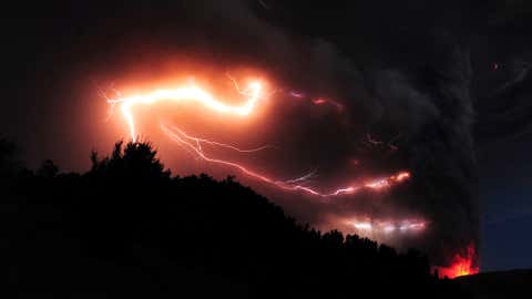 Lightning is seen amid a cloud of ash billowing from Puyehue volcano near Osorno in southern Chile on June 5, 2011. (Claudio Santana/AFP/Getty Images)