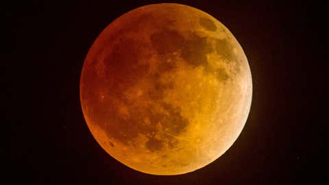 Total eclipse of the moon underway over southern California as seen from Korea town ,west of downtown Los Angeles, early on April 15, 2014. (Desiree Martin/AFP/Getty Images)