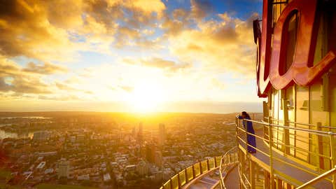 A visitor scans the skyline and harbour of Sydney from a viewing platform at the Sydney Tower Eye in Sydney, Australia. (Eugene Tan/Hausmann Communications via Getty Images)