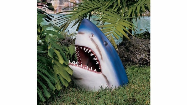 Feeling landlocked in the suburbs? The great white shark can add a tropical splash to backyard. (Image: Skymall.com)