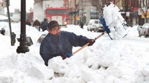 A Brooklyn resident begins the task of digging out a path along the sidewalk January 9, 1996 in New York. Credit: JON LEVY/AFP/Getty Images