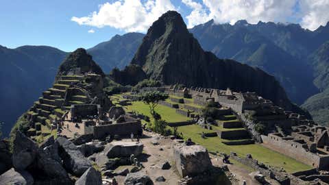 Tourists walk among the ruins of the Machu Picchu citadel, Cusco, Peru on July 6, 2011.  (Cris Bouroncle/AFP/Getty Images)