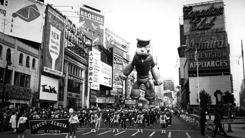 November 1961: A Thanksgiving parade in New York. Floating above the majorettes is a giant inflatable Popeye. (Express Newspapers/Getty Images)