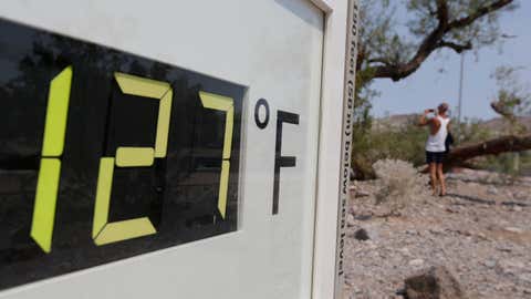 A visitor to the Furnace Creek Visitor Center walks by a thermometer in Death Valley National Park Friday, June 28, 2013 in Furnace Creek, Calif. (AP Photo/Chris Carlson)