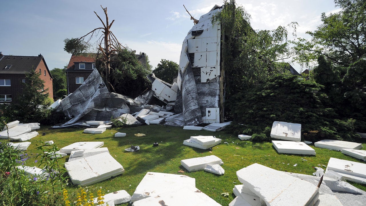 The remains of a roof are scattered on June 10, 2014 in Neuss, Germany. (HENNING KAISER/AFP/Getty Images)