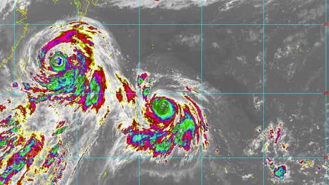 Infrared satellite image from Himawari-8 satellite of Typhoon Chan-hom (left) and Super Typhoon Nangka (left-center) in the western Pacific Ocean on July 9, 2015 at 12 p.m. U.S. EDT. (JMA/CIRA/RAMMB)