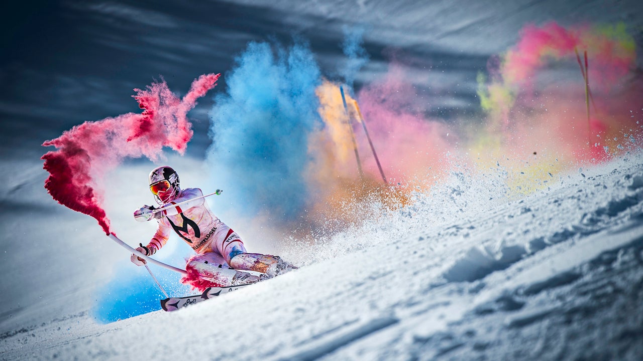Alpine skiing champion Marcel Hirscher creates an explosion of colors as he skis down a steep race course at the Reiteralm ski resort in Austria with poles filled with colored powder paint. (Markus Berger/Red Bull Content Pool)
