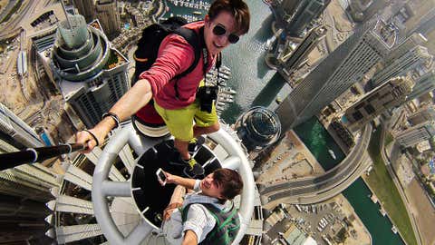 Nineteen-year-old Alexander Remnev scaled the Princess Tower - the worlds tallest residential building at 1,350 feet - before getting his camera out to take these stomach-churning pictures. (Alexander Remnev/Caters News Agency)