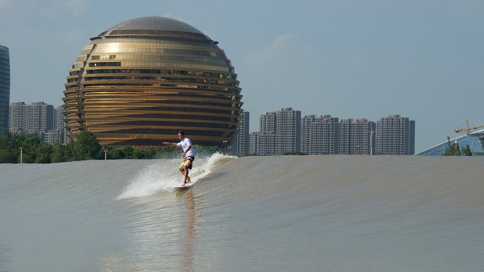 A surfer on the Qiantang River in China. (Wabsono Int./ Glenn Brumage)
