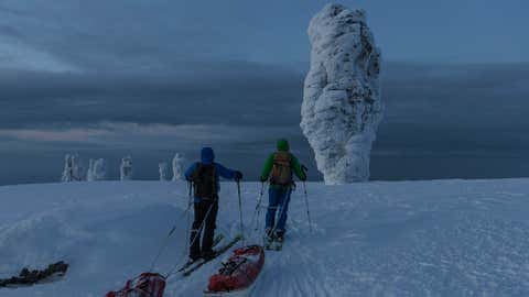 Stefan Glowacz and Uli Theinert on the way to climb a Manpupuner rock formation located north of the Ural mountains in the Troitsko-Pechorsky District, Komi Republic, Russia on February 17, 2013. (Klaus Fengler/Red Bull Content Pool)