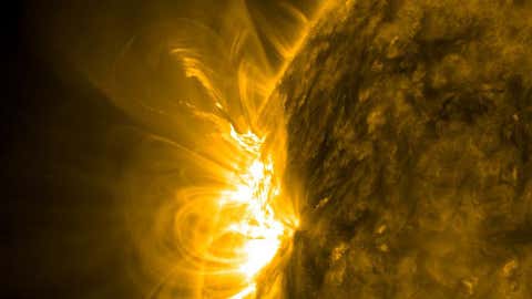 This close-up look at an active region taken on July 9, 2010, shows a hotbed of magnetic activity, including a small solar flare bursting out into space. (NASA Solar Dynamics Laboratory)