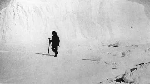 Circa 1911: Norwegian explorer Captain Roald Amundsen, the first man to reach the South Pole, inspecting ice fields near a glacier in the Atlantic Ocean. (Keystone/Getty Images)