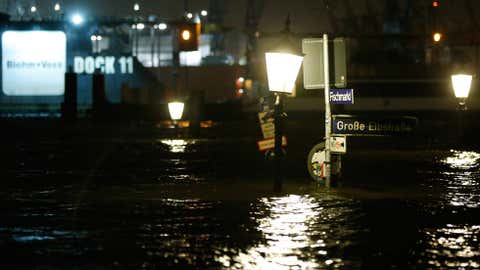 Roadsigns peak out of the water on the flooded 'Fischmarkt' (fish market) on December 6, 2013 in Hamburg, Germany. (Philipp Guelland/Getty Images)