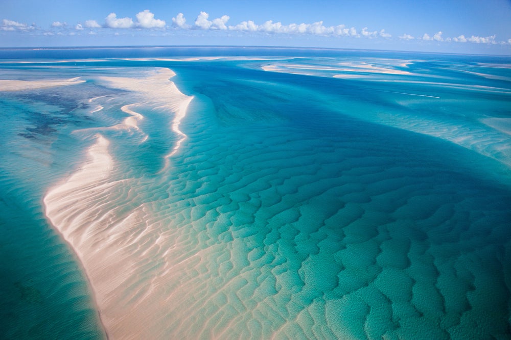 MacDonald captures a look at the horizon from her paraglider above a massive sand dune in the Bazaruto island chain. (Image: Jody MacDonald)