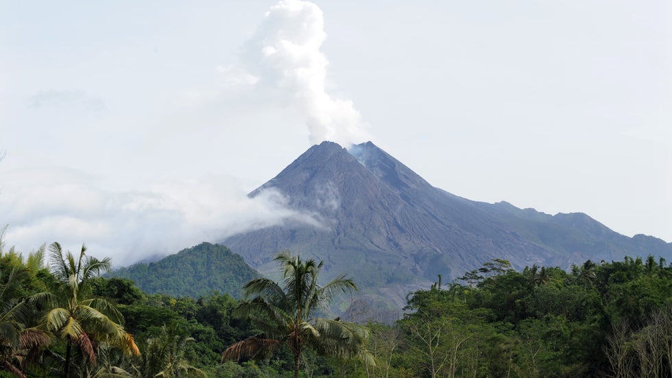 Photo taken on January 30, 2011 shows the mount Merapi volcano in Sleman, Yogyakarta. Javanese villagers who survived the violent eruptions of Mount Merapi volcano last year are tapping into the macabre market for disaster tourism to help rebuild their shattered lives. (ADEK BERRY/AFP/GettyImages)