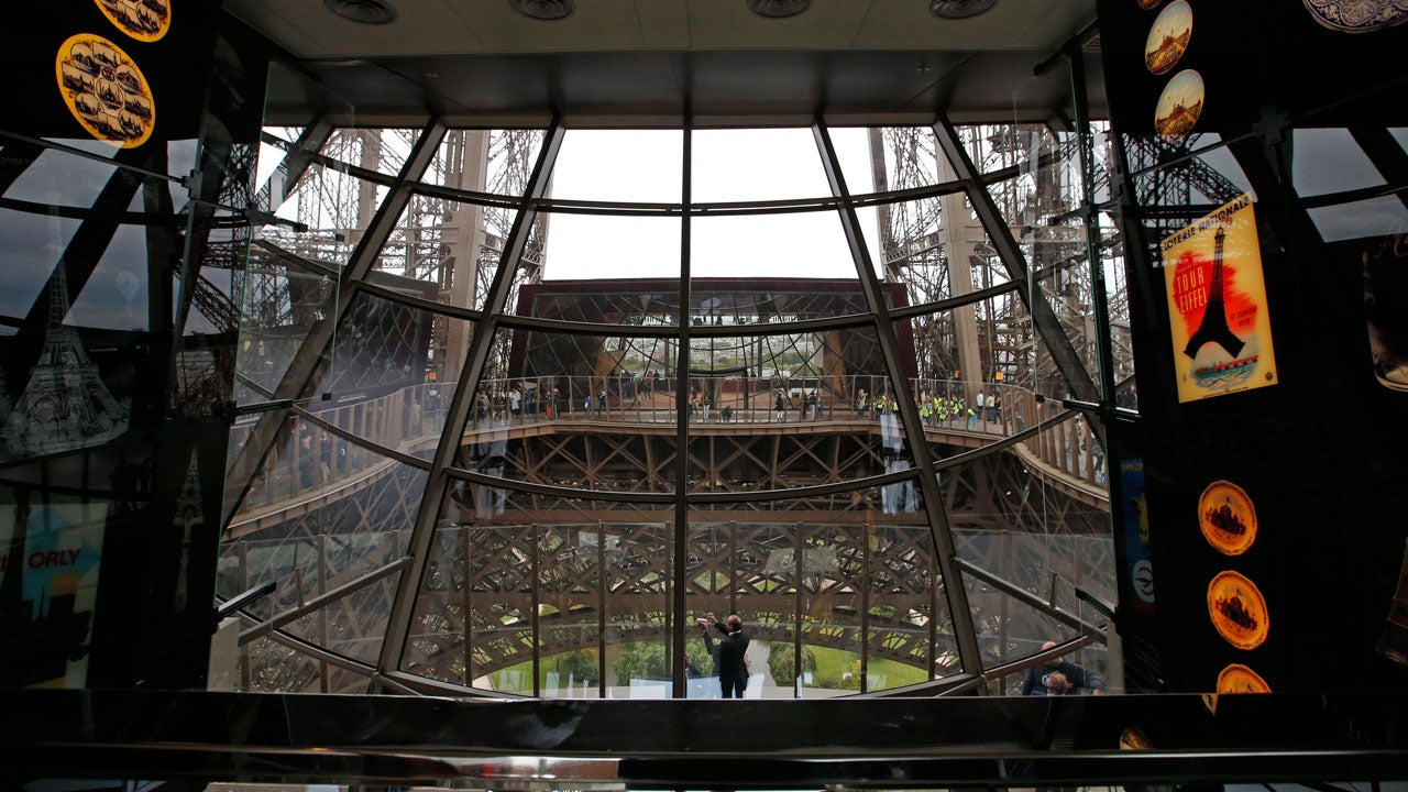 A view of the exhibition room with the new glass floor at the Eiffel Tower during the inauguration of the newly refurbished first floor, in Paris, France, Monday, Oct. 6, 2014. (AP Photo/Francois Mori)
