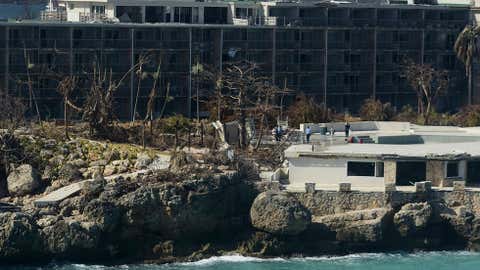 A damaged hotel stands after the passage of Hurricane Irma, close to the airport, in Phillipsburg, St. Martin, Monday, September 11, 2017. Irma cut a path of devastation across the northern Caribbean, leaving thousands homeless after destroying buildings and uprooting trees. (AP Photo/Carlos Giusti)