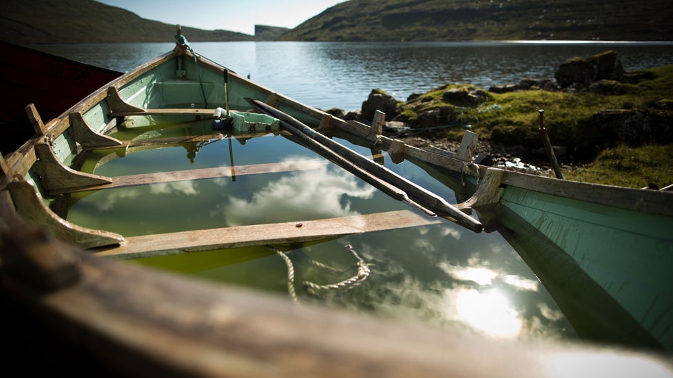 A view of a boat filled with rain water at Sorvagatsn lake on Sept. 7, 2013 at Vagar, Faroe Islands.  (Simon Hofmann/Getty Images)