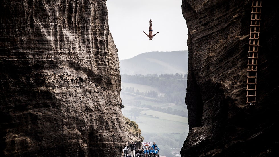 In this  image provided by Red Bull, Jonathan Paredes of Mexico dives from the 27 meter platform during the first competition day of the Red Bull Cliff Diving World Series on June 28, 2013 at Islet Vila Franca do Campo, Azores, Portugal. (Romina Amato/Red Bull via Getty Images)