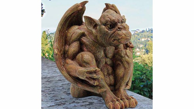 This gargoyle sits watch, shooting dirty looks at anyone who dare mess with your garden. (Image: Skymall.com)