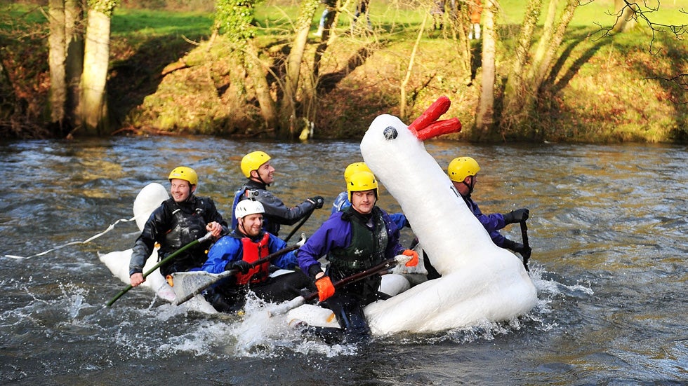 Participants on decorated vessels take part in the Matlock Raft Race on December 26, 2013 in Matlock, England. The race starts on the River Derwent in Matlock and finishes at Cromford Meadows two miles downstream. (Bethany Clarke/Getty Images)