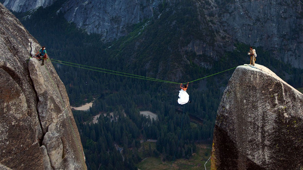 A bride does the Tyrolean traverse to Lost Arrow Spire in Yosemite National Park, California. (Ben Horton/National Geographic Creative/Caters News Agency)