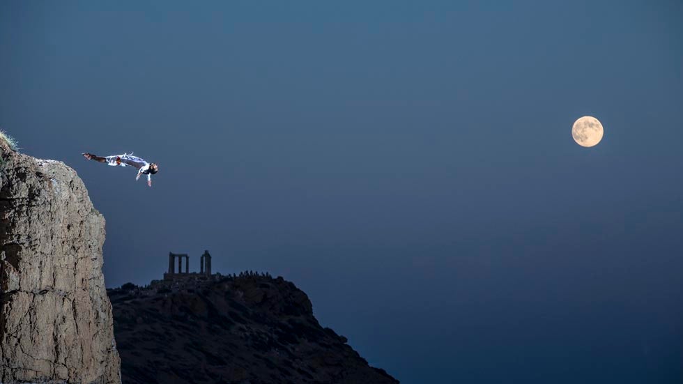 Orlando Duque dives during a full moon in Cape Sounio, Greece on August 21, 2013. (Samo Vidic/Red Bull Content Pool)