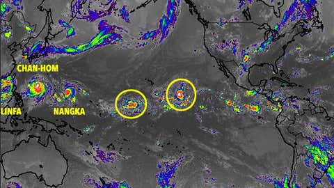 Pacific Ocean satellite image showing three western Pacific tropical cyclones and two disturbances in the central Pacific on July 7, 2015 at 1415 UTC. (NASA/MSFC/JMA)