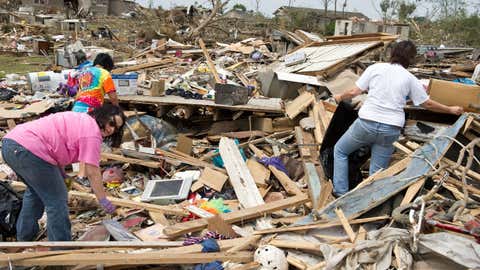 Residents sift through debris in the devastated town of Hueytown,Alabama,on May 1,2011. (NICHOLAS KAMM/AFP/Getty Images)