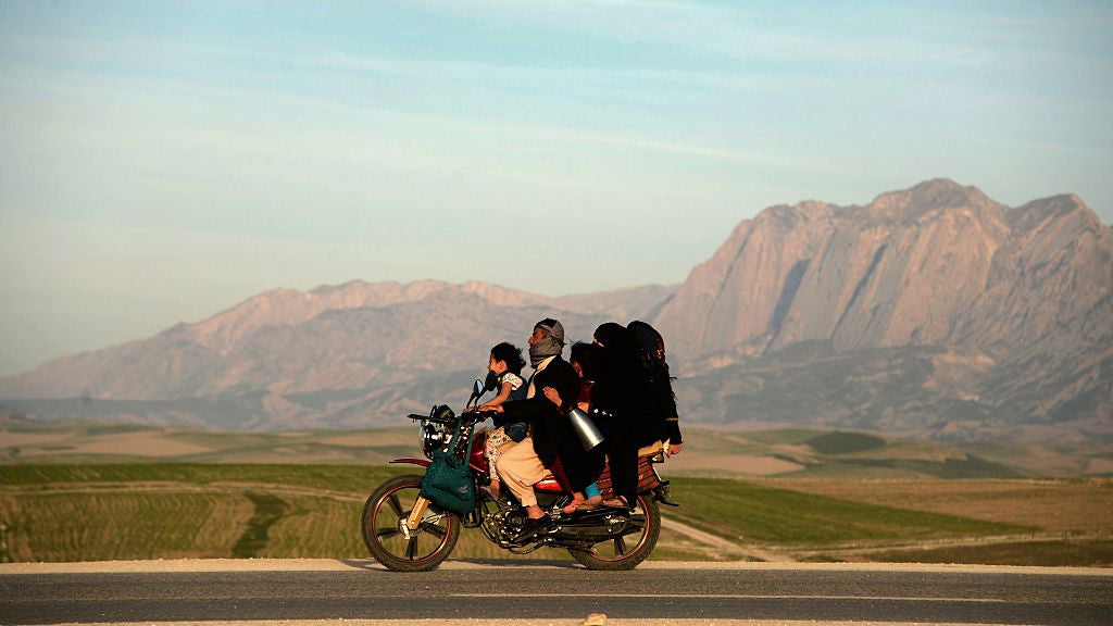 An Afghan family travel to celebrate Nowruz. (FARSHAD USYAN/AFP/Getty Images)