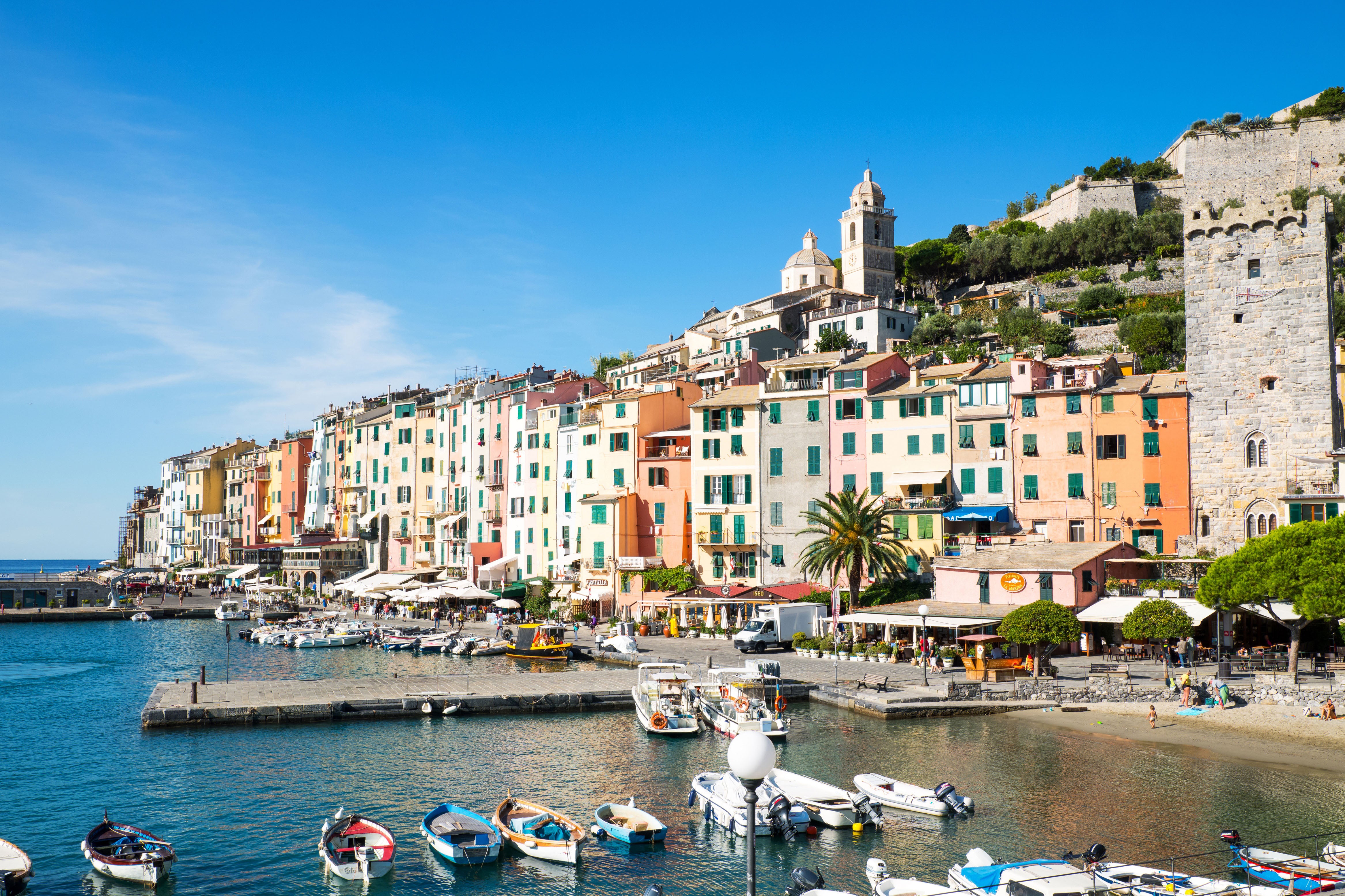 Italy. Liguria. Porto Venere. Panoramic view of the village with the ancient remains. in the foreground the harbor with fishermen and touristic boats. (Photo by: Masci Giuseppe/AGF/UIG via Getty Images)
