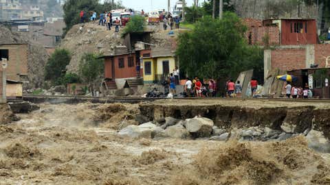 View of sections of the central railroad track that follows the Rimac River, which suffered severe damage by rising water and flash foods in the town of Chosica, at the foot of the Andes mountains east of Lima, on March 18, 2017. (CRIS BOURONCLE/AFP/Getty Images)