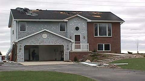 A home near Calumet, Wisconsin suffered hail damage on May 12, 2000.