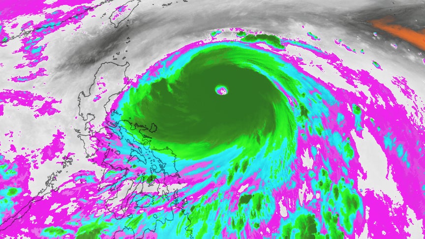 Water vapor image from the Himawari-8 satellite of Super Typhoon Haima on Oct. 18, 2016 at 12:00 p.m. EDT. Increased moisture is shown by purple, blue and green contours. (JMA)