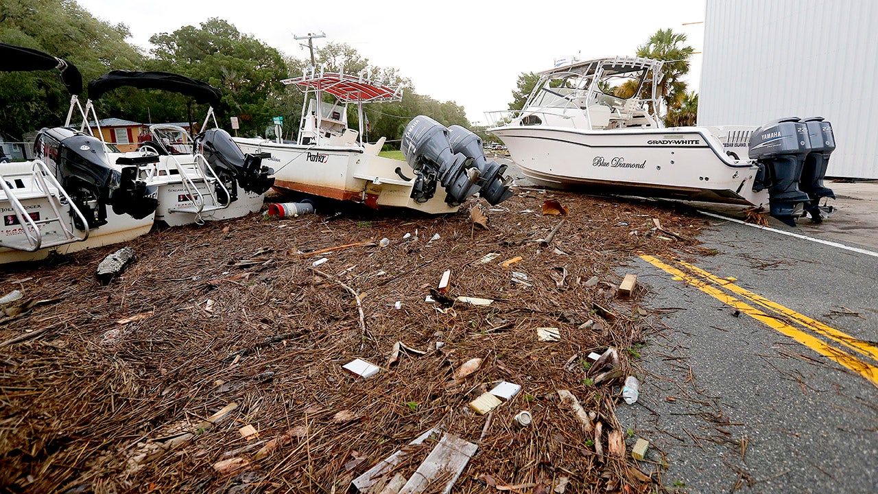 Debris and boats are scattered across the road in Steinhatchee, Florida after Hurricane Hermine tore through the area on Friday, Sept. 2, 2016. Hermine was downgraded to a tropical storm after it made landfall, as it moves over Georgia. (Matt Stamey/The Gainesville Sun via AP)