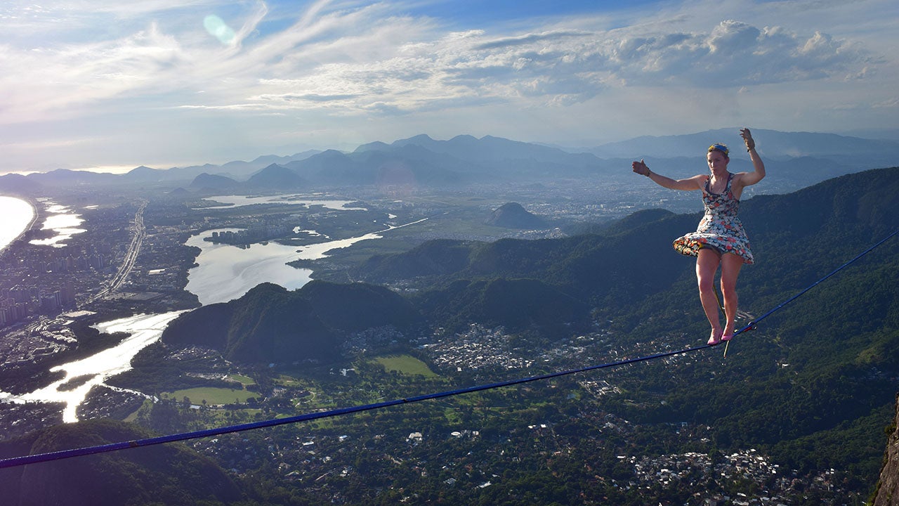 Faith Dickey, 26, from Austin, Texas, made the hair-raising highline walk during the Highgirls Brazil Festival in a pair of bright pink heels. (Reginaldo Gomes / Caters News)