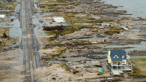 A home is left standing among debris from Hurricane Ike September 14,2008 in Gilchrist,Texas. (Smiley N. Pool-Pool/Getty Images)