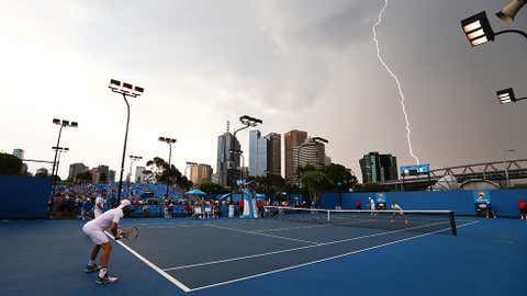 Lightning strikes over Melbourne Park during the first round doubles match between Rameez Junaid of Australia and Adrian Mannarino of France, and Rohan Bopanna of India and Aisam-Ul-Haq Qureshi of Pakistan during day four of the 2014 Australian Open at Melbourne Park on January 16, 2014 in Melbourne, Australia. (Robert Prezioso/Getty Images)