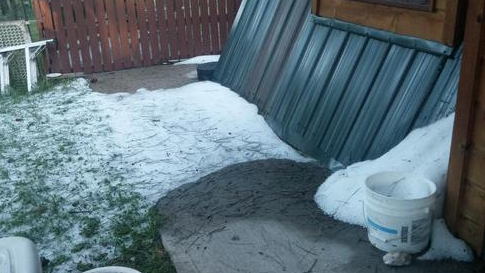 A yard remains covered in hail near Custer, South Dakota, on the morning of Tuesday, July 28, 2015, some 13 hours after a hailstorm struck the area Monday evening. (Credit: Nature Tech Family/Twitter)