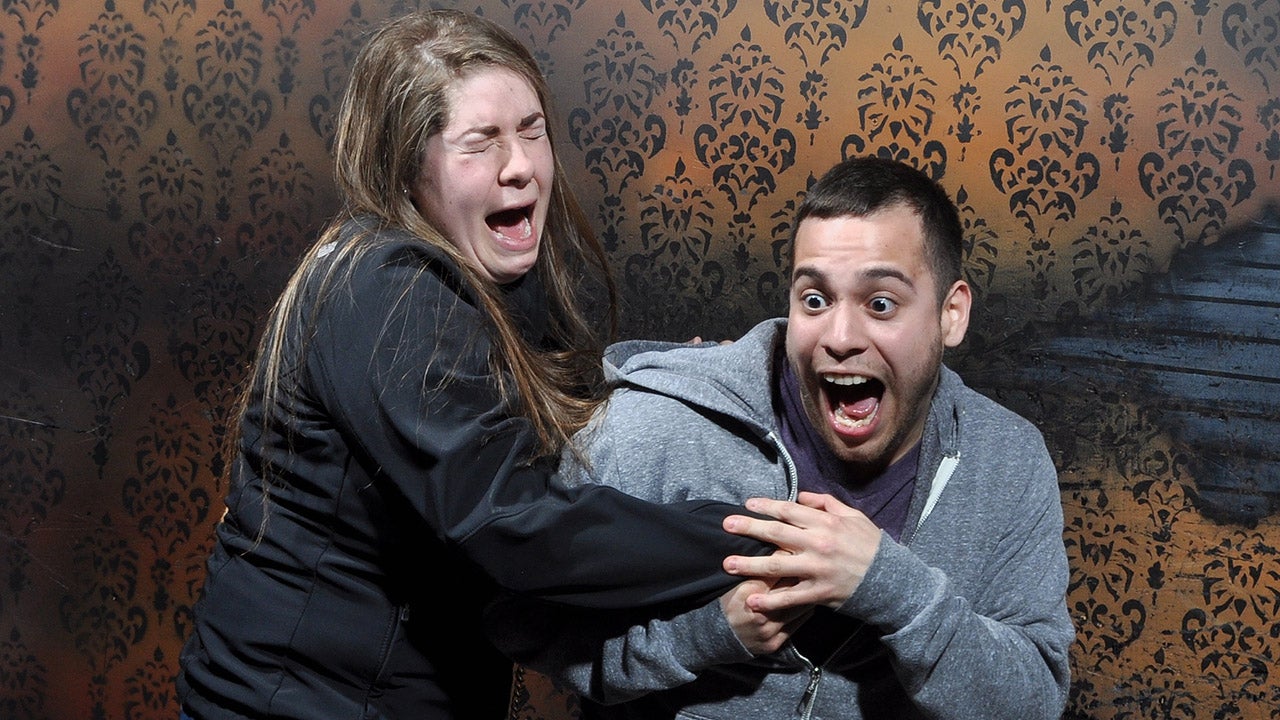 Terrified tourists react during a 15-minute, pitch-black tour through the &lsquo;Nightmares Fear Factory&rsquo; haunted house in Niagara Falls, Canada. (NightmaresFearFactory.com)