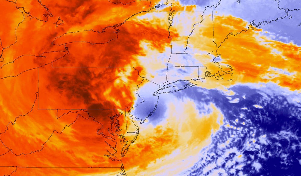 A GOES-13 satellite colorized infrared image of Sandy making landfall in New Jersey.