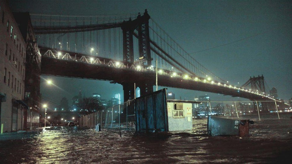 Streets are flooded under the Manhattan Bridge in the Dumbo section of Brooklyn, N.Y., Monday, Oct. 29, 2012.