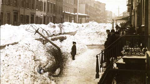 Downed wires and lamp post in Greenwich Village after the Blizzard of 1888 in New York City. (Credit: New York Historical Society Museum & Library)