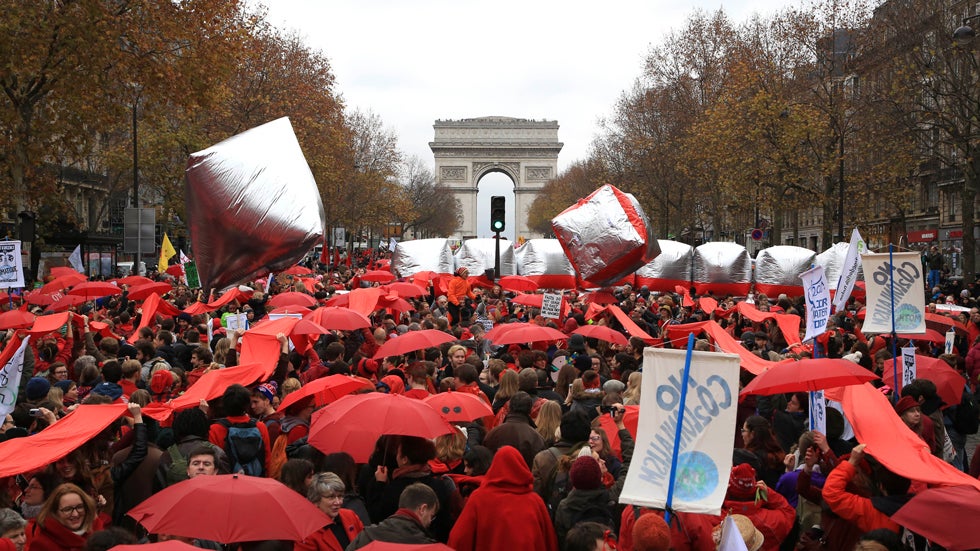 Climate activists demonstrate in Paris, Saturday, Dec.12, 2015 during the COP21, the United Nations Climate Change Conference. (AP Photo/Matt Dunham)